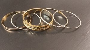 Five goldtone bangles bracelets